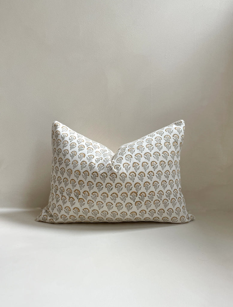 Front view of a 14x20” rectangle lumber luxury cotton Hand-woven cushion cover in a neutral tone featuring a tan floral pattern with a cotton back and invisible zipper. Displayed against a neutral limewash background, made in the United Kingdom